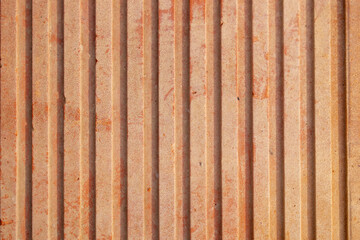 Orange brick closeup pattern with copy text space. Real texture. Industrial element for construction in buildings. Vertical.