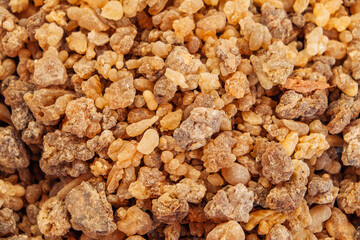 Yellow and orange background of various incense and incense stone material on the market