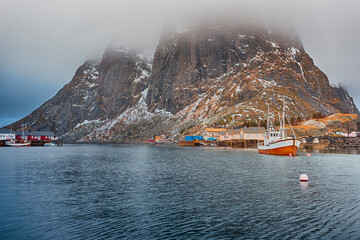 Norway Traveling. Pier in One Fishing Village Hamnoy and Sakrisoy on Lofoten in Norway During Sunrise in Early Spring.