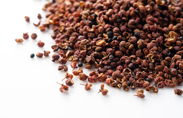 Sichuan pepper placed on a white background.