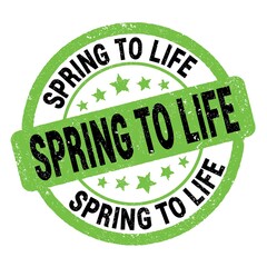 SPRING TO LIFE text written on green-black round stamp sign.