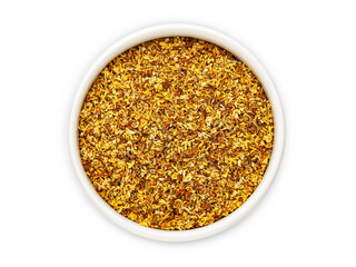 Dried osmanthus flowers in a white bowl on a white background, top view, isolate, flat lay. Herbal medicine. Healing tea.