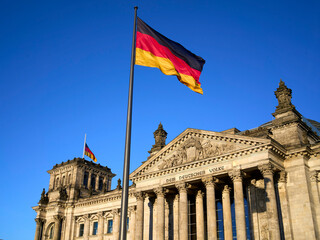German parliament with German flag (Reichstag building) in central Berlin