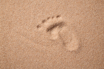Innocent Beach Adventures: Child's Footprints on Sandy Shore