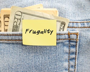 Money in jeans pocket with handwritten note FRUGALITY, latest trend In Work-Life Balance -...