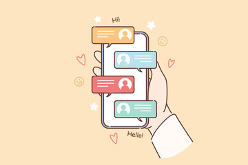 Mobile phone with messages in hands of person using social networks to correspond with friends