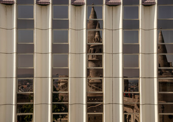 Abstract background of reflections in the modern windows of old Budapest.