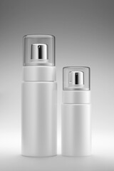 3d rendering of skin care cosmetic product duo with two spray bottles unlabeled with transparent caps isolated on gray background.