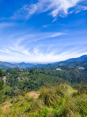 Beautiful mountain tropical landscape with green hills and blue sky. Photography for tourism background, design and advertising.