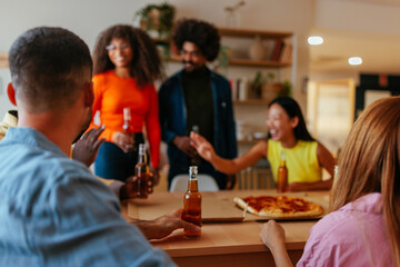 Joyful group of friends at home.