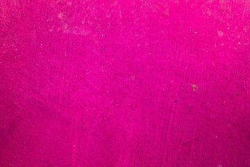 Magenta Background. Concrete Texture wall painted magenta. Space for design and text.
