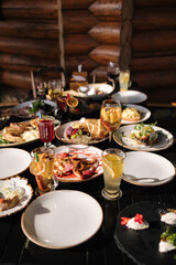 Served table with food and drinks. Restaurant on terrace. 