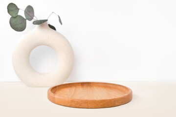Round Wooden Podium for Food, Products against White Wall. Ceramic Vase. Empty Natural Form. Pedestal Showing Eco Organic Cosmetics, Jewelry. Trendy Minimal Style Mock Up. Neutral Studio Background