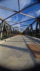 Fototapeta na wymiar Truss bridge over the river