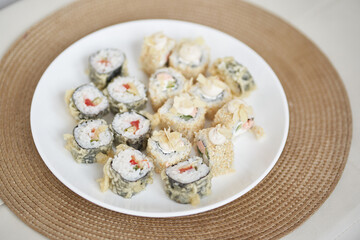 Delicious rolls with tofu and vegetables. Japanese rolls are on a plate. Japanese cuisine in the restaurant is prepared from exquisite ingredients. High quality photo