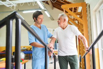 Physiotherapist assisting senior man in movement therapy