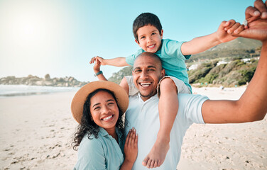 Family, happy and portrait at beach for summer with child, mother and father for fun. Man, woman and boy kid smile for happiness, play and freedom on a holiday with love, adventure and travel outdoor