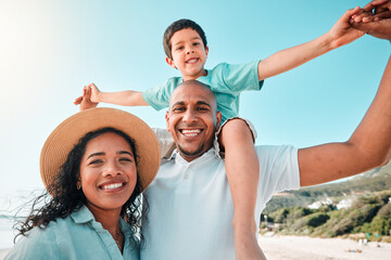 Happy family, smile and portrait at beach for summer with child, mother and father for fun. Man, woman and boy kid playing for happiness and freedom on a holiday with love, care and support outdoor