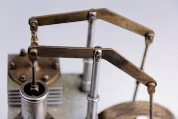 closeup of a stirling engine construction isolated on white