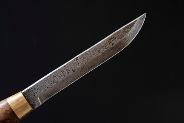 Damascus steel knives on a black background. Kitchen knives. background with japanese knife. A set...
