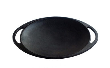 Black colored, empty clean cast iron roasting pan with handle on white surface