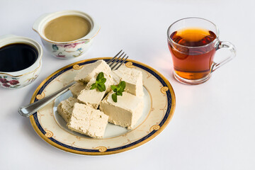 Traditional Turkish grape molasses, tahini and plain halva group designed on plates