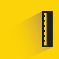 ruler with shadow on yellow background