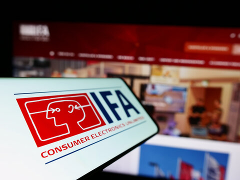 Stuttgart, Germany - 04-02-2023: Smartphone with logo of Internationale Funkausstellung Berlin (IFA) on screen in front of business website. Focus on left of phone display.