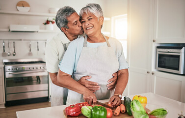 Cooking vegetables, hug and elderly couple with kitchen ingredients, prepare food or smile on romantic home date. Nutritionist, marriage love and hungry man, woman or people bonding over healthy meal