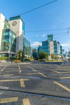 Vertical shot of the facade of IFSC House and Touche House with yellow line marking, Dublin, Ireland