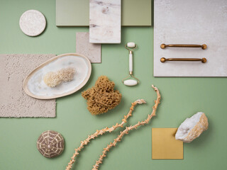 Fototapeta na wymiar Stylish flat lay composition in green and yellow color palette with textile and paint samples, lamella panels and tiles. Architect and interior designer moodboard. Top view. Copy space.