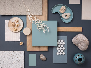 Creative flat lay composition with textile and paint samples, panels and cement tiles. Stylish interior designer moodboard. Blue and beige color palette. Copy space. Template.