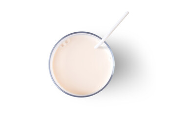 Glass of fresh soymilk with drinking straw isolated on white background. Top view. Flat lay.