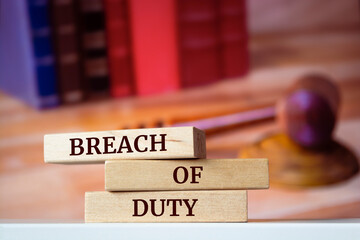 Wooden blocks with words 'BREACH of DUTY'. Legal concept - obrazy, fototapety, plakaty
