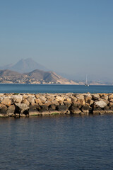Stone Pier at El Campello Beach, Alicante; Spain - 592233519