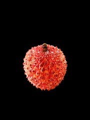 Closeup of Lychee tropical fruit on a black background