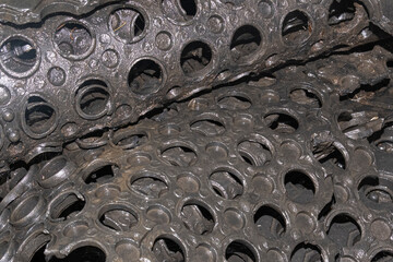 Black rubber floor mat with holes pattern