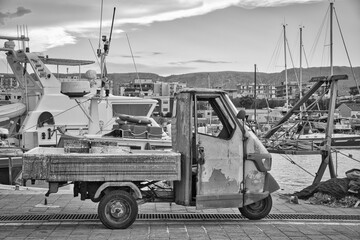 Old vessel parked in port of Manfredonia in black and white