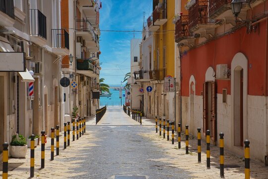 Aerial view of narrow street surrounded by buildings in Manfredonia