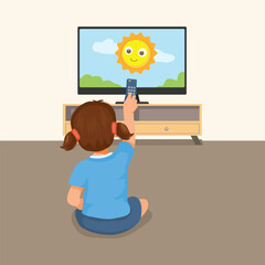 Cute little girl watching TV holding remote control sitting on the floor