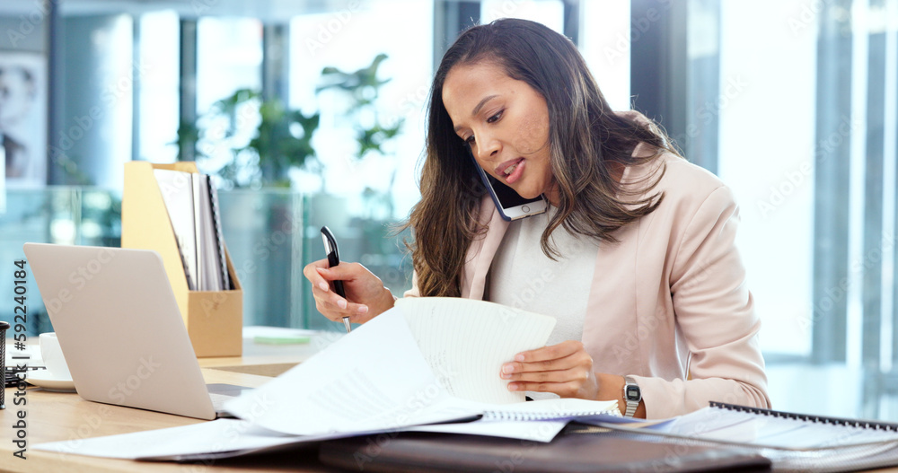 Poster Female advertising agent looking busy while talking on a phone call and searching through documents on a messy table in an office. Female marketing professional trying to find an important form