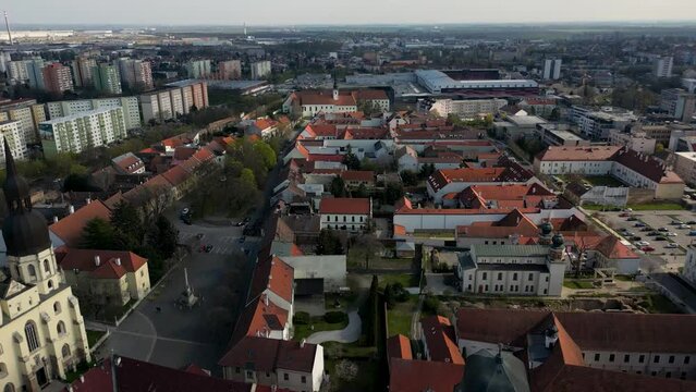 Saint Nicolas Church on the side and the cityscape of Trnava, Slovakia, 4k