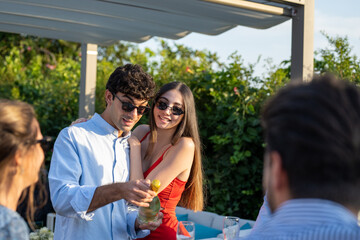 Naklejka premium Young people celebrating a private event together, engagement party or wedding of a young couple