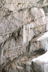 icicles in a cave with snow