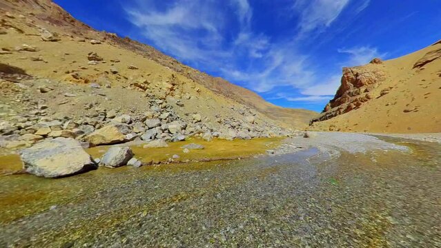 Calm water flowing on mountain road