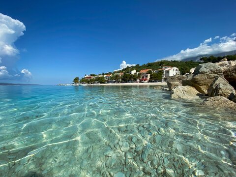 Beautiful seascape with clear blue water by the coastal town of Bratus in Croatia on a sunny day