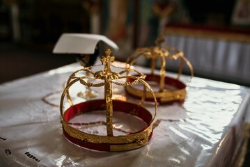 Fototapeta na wymiar Golden church crowns on a table
