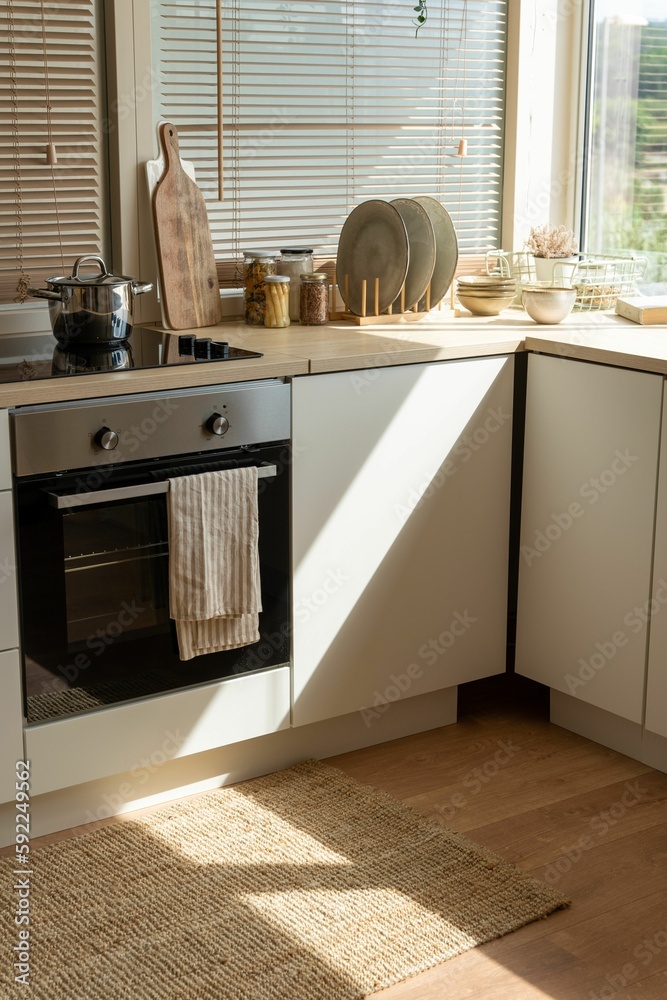 Wall mural vertical shot of a cozy interior of a modern kitchen