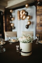 Vertical shot of a festive table and 18 birthday decoration with golden anniversary balloons