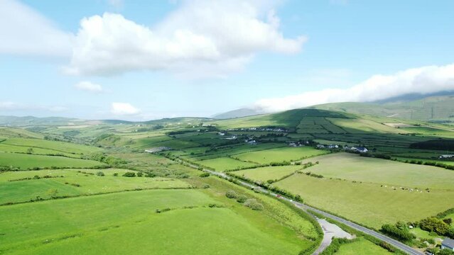 Aerial view of green agricultural fields in Ireland on a sunny morning